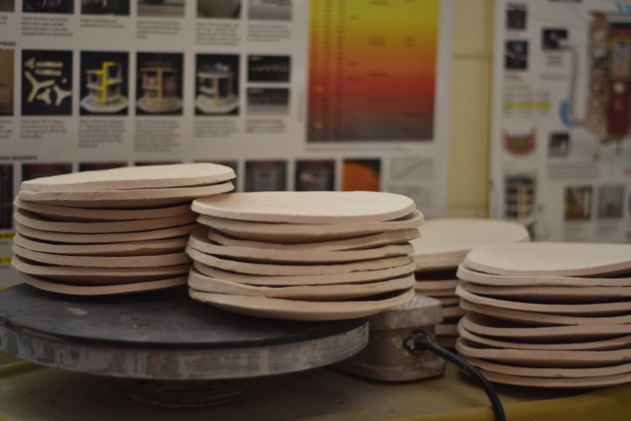 Stacks of bisque plates created by Mrs.Cooke and her daughter are ready for the Art Night