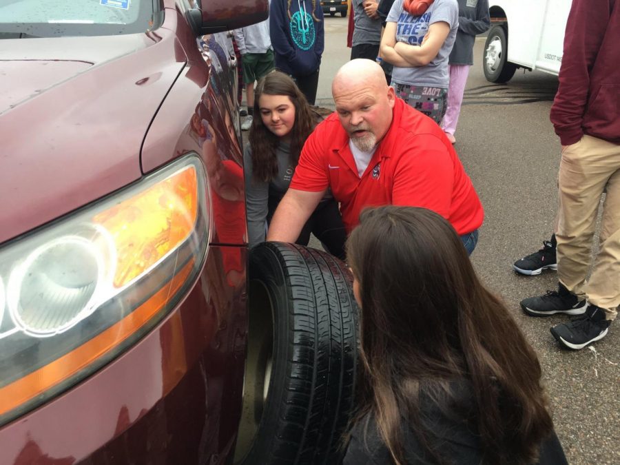 Goldie teaches students to change a tire and jump a car battery (via @KingsEmployabi1 on Twitter)