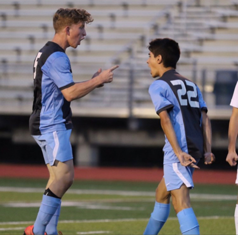 Seniors Parker Knight and Eric Middlekamp celebrate a big goal. (photo via Jim Schult)