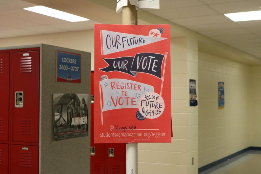 Students+Demand+Action+places+signs+around+the+school+for+their+Voter+Drive.