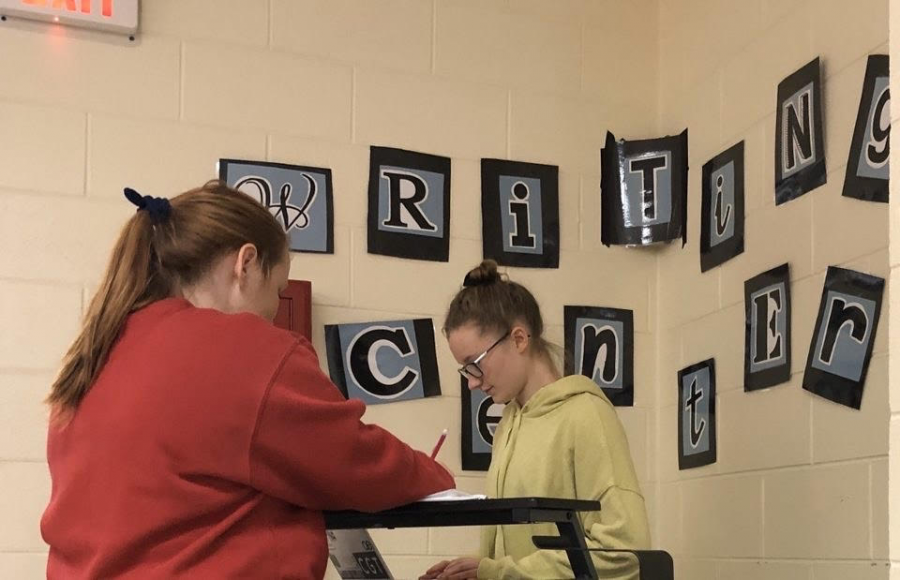 Kaitlyn Beauchamp, helping a student at the writing center
