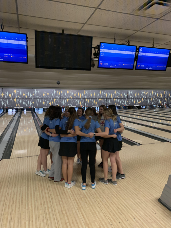 Image of the team huddling up before a match