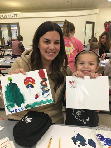 Families show their art made together during Community Art Night