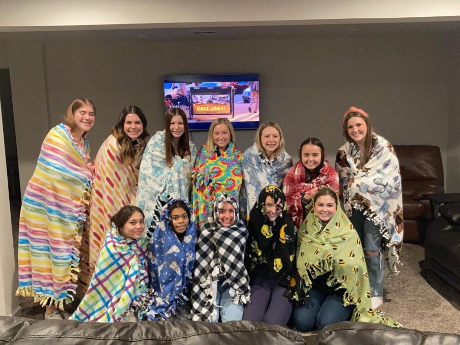 The+gymnastics+team+with+their+blankets+to+donate+to+charity