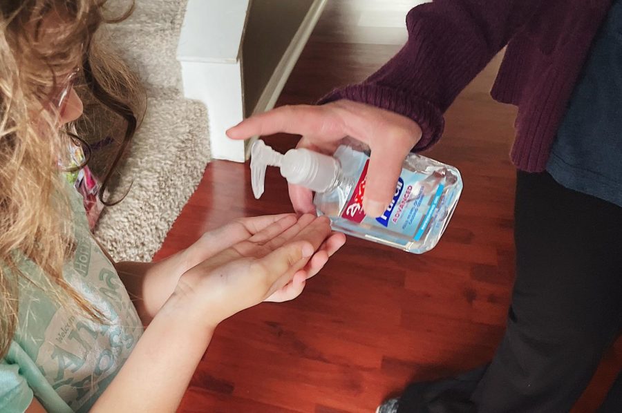 Kindergartner, Isla Baumann, welcomed home from school with a squeeze of hand-sanitizer. A small step in her daily routine after the rapid spread of COVID-19 throughout schools. 
