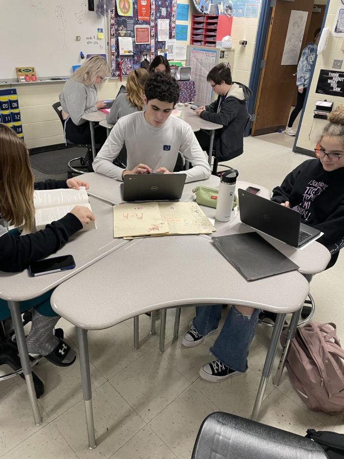 Blake Rainey, Abigail Noble, and Mia McFaline completing work for Mrs. Kings Law and Criminal Justice class.