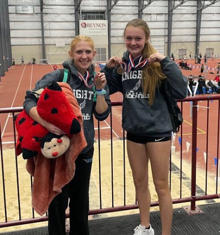 Sara Doughman (left) and Zoe Lenny (right) show off their medals at the Indoor State Meet.