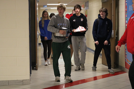 Ben Shrimplin substitutes his backpack for a crockpot.