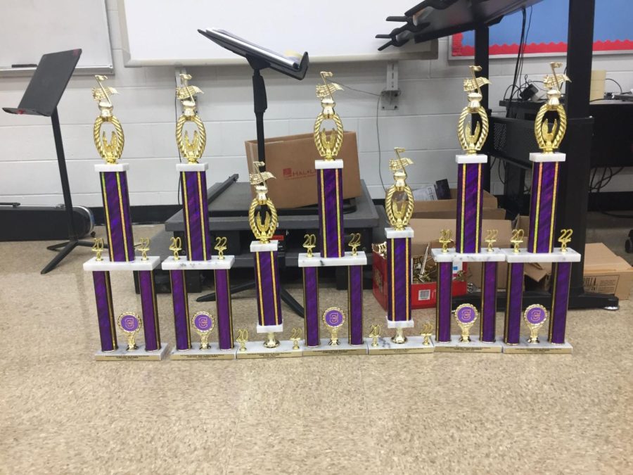 The band won six trophies in total at their out-of-state performance, placing in third place overall (left to right: Class AAAA Best Visual, Class AAAA Best General Effect, Class AAAA 1st place, Class AAAA Best Auxiliary, 3rd place Overall, Class AAAA Best Percussion, Class AAAA Best Music)