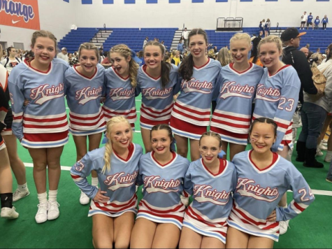 : The competition cheer team smiles with the excitement of the news of making it to nationals.