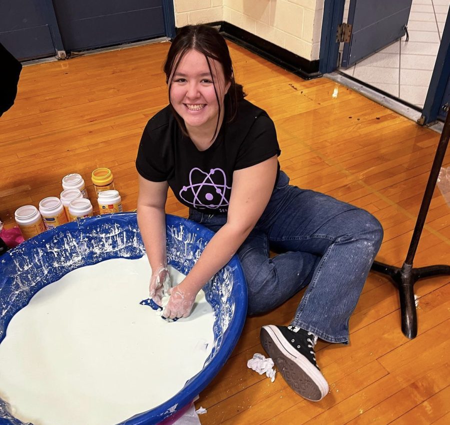 Alyssa Kim poses with mind-boggling Oobleck during STEM Fair.