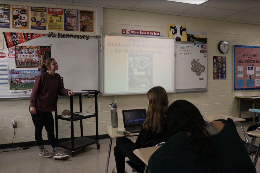 Teacher Sarah Hennessey teaches a lecture about adult development to her psychology class. It’s common for teachers to feel the need to wear a smile in front of their students even with their overwhelming stressors. 