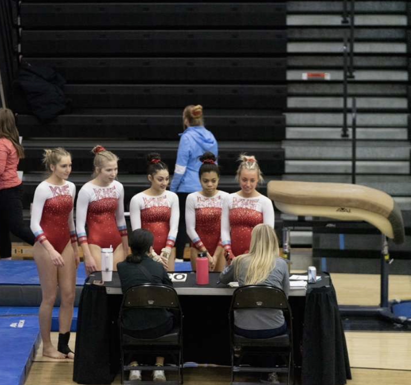The score is in. Lady Knights go to the judges table to see their scores. Photo credits Jan Powers
