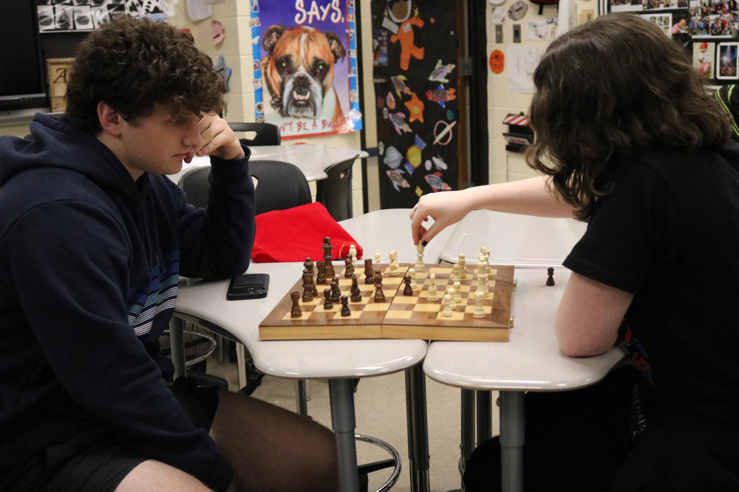 Pupil Kid Thinking About His Next Move In A Game Of Chess. Clever  Concentrated And Thinking Child While Playing Chess. Little Clever Boy  Thinking About Chess. Games Good For Brain Intelligence. Stock