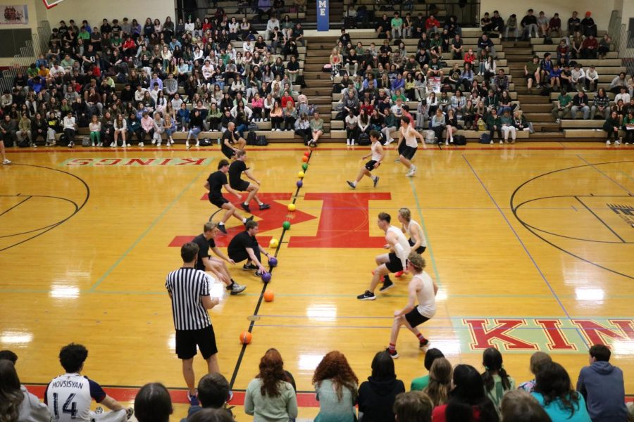 Juniors and Seniors watch in anticipation as dodgeball teams Triple B and the Schmoe City Slimes face off to see who places for finals in the tournament. 