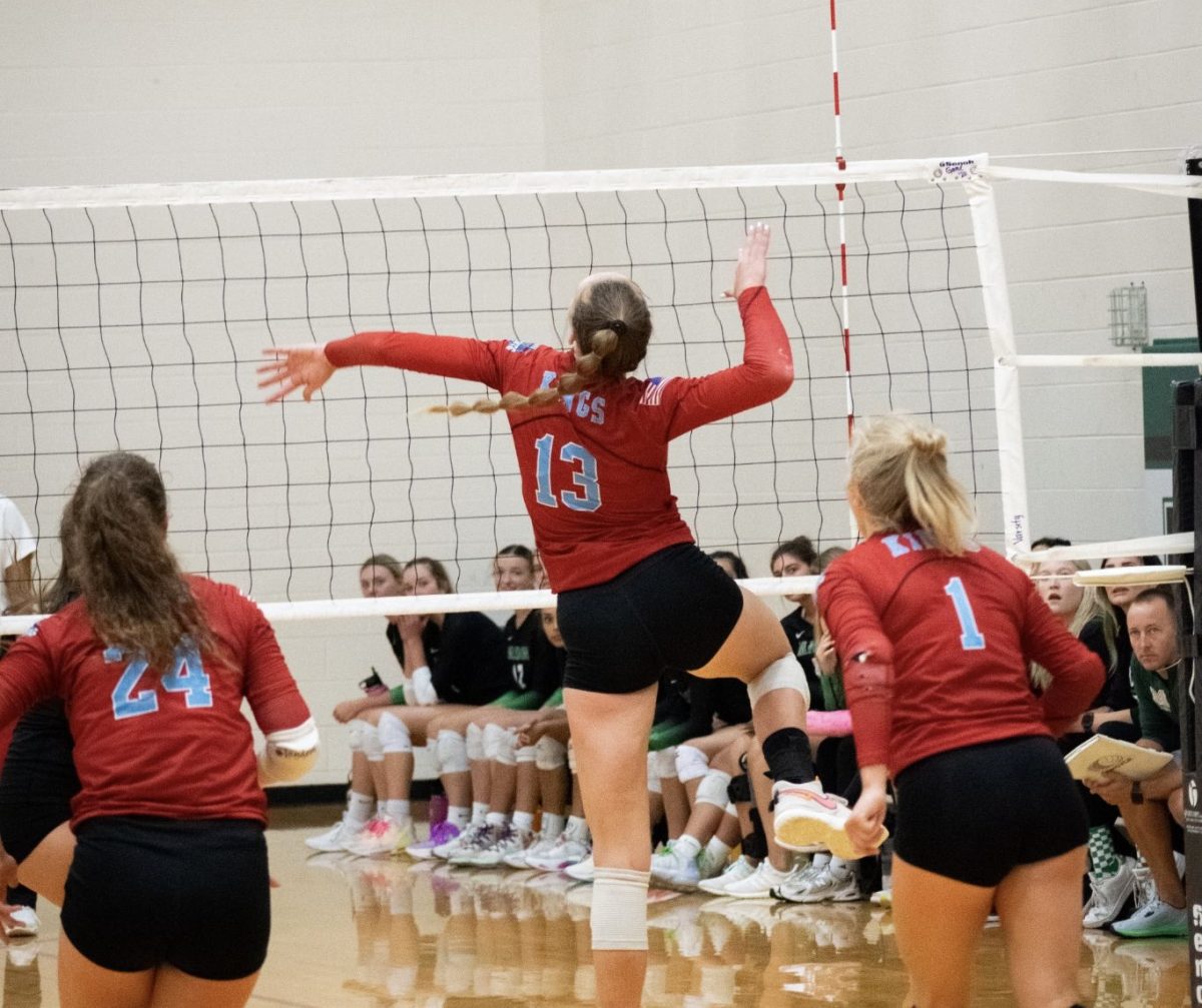 Elise Marchal goes up for another kill against Mason.